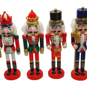 May include: Four decorative wooden nutcrackers in various uniforms. Each nutcracker has a unique design, including red, green, and blue coats, gold crowns, and white hair. They stand on red circular bases, perfect for holiday decor.