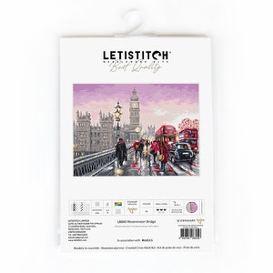 May include: A cross-stitch kit featuring a detailed image of Westminster Bridge in London, with red double-decker buses, a clock tower, and figures walking in the rain. The kit is packaged in a white sleeve with the brand name "LETISTITCH".