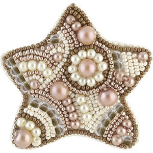 May include: A star-shaped beaded ornament with a brown, white, and pink color scheme. The ornament is made of small beads and pearls, creating a textured and intricate design.