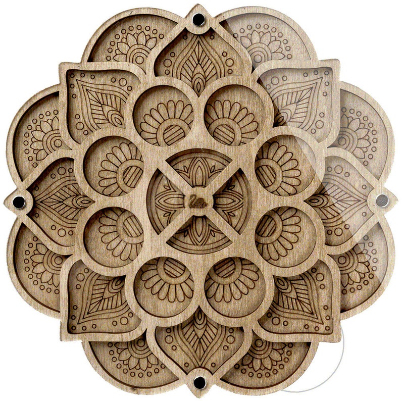 May include: A wooden mandala with intricate laser-cut designs. The mandala is divided into eight sections, each with a different pattern. The center of the mandala features a smaller, more detailed design.