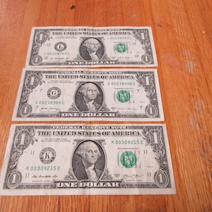 a lot of THREE low number one dollar  bills federal reserve note dollar bill money, currency, K00309215E G00238906C L00108760L