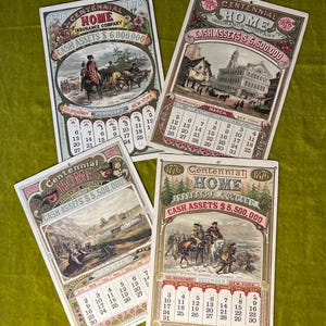 May include: Four vintage calendars from the Home Insurance Company, each featuring a different scene and month. The calendars are printed on thick paper with gold accents and feature the company's logo and slogan: "Centennial 1776 Home Insurance Company 1876".