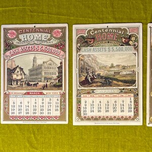 May include: Four vintage calendars from the Centennial Home Insurance Company. Each calendar features a different month and a different image. The calendars are all in good condition and have a faded, antique look.