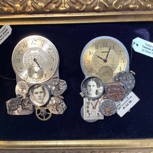 May include: A framed artwork featuring two vintage pocket watches with gears and a small photo of a young woman and a young man. The artwork is titled "Daddy's Timeless Jewels by Cheryl Young".