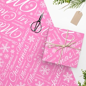 Name gift wrap in pink white snowflakes