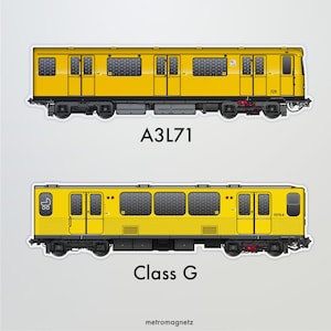 May include: Two yellow subway train models, one labeled "A3L71" and the other "Class G". Both models have black windows and black wheels.