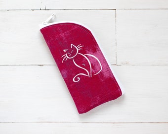 May include: A pink fabric zippered pouch with a white outline and a white stylized cat design.