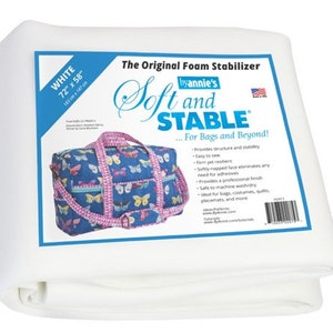 May include: White foam stabilizer sheet, 72 inches by 58 inches, labeled "The Original Foam Stabilizer byannie's Soft and STABLE... For Bags and Beyond!" with a list of features and a picture of a blue and pink bag with butterflies.