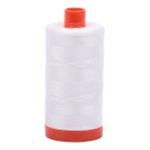 May include: A white spool of thread with an orange plastic top and bottom.