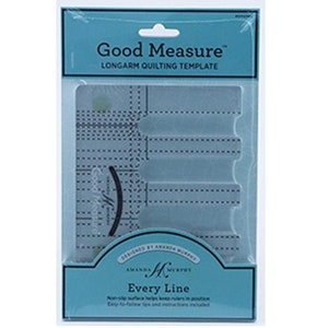 May include: A clear plastic quilting template with a blue border and the text "Good Measure" and "Longarm Quilting Template". The template has a series of lines and curves for quilting designs. The text "Designed by Amanda Murphy" and "Every Line" is also visible.
