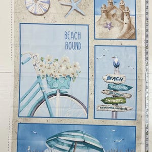 May include: A beach-themed fabric panel with a blue bicycle with white flowers in the basket, a sandcastle, and a sign that reads "Beach Cabanas, Ice Cream, Showers, Umbrella Rentals". The panel also features a blue and white striped umbrella and two white chairs on a beach.