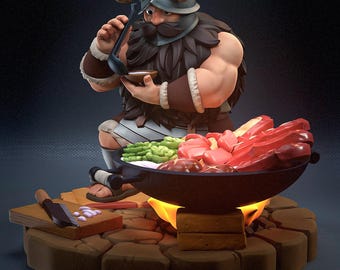 May include: A 3D-rendered figurine of a Viking chef kneeling near a grill. The chef wears a horned helmet and fur-lined clothing, holding a ladle over a bowl. The grill contains raw meat and vegetables, with flames visible. A wooden cutting board and axe are nearby.
