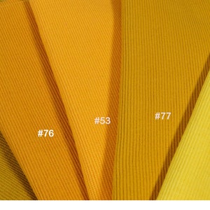 May include: Five fabric swatches in different shades of yellow, from a dark mustard to a bright yellow. The swatches are labeled with numbers: #75, #76, #53, #77, and #78.
