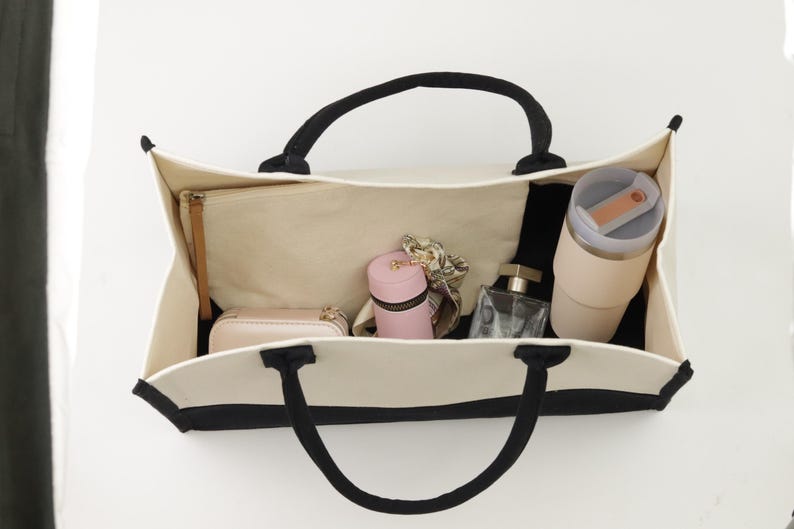 a purse hanging on a wall with a lot of items inside