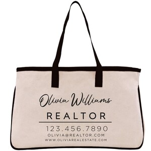 a white and black bag with a logo on it