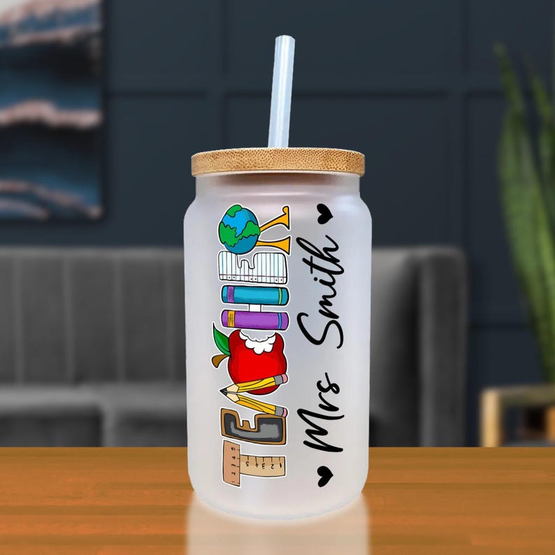 a glass with a straw in it sitting on a table