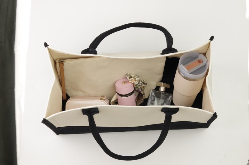 a purse hanging on a wall with a lot of items inside