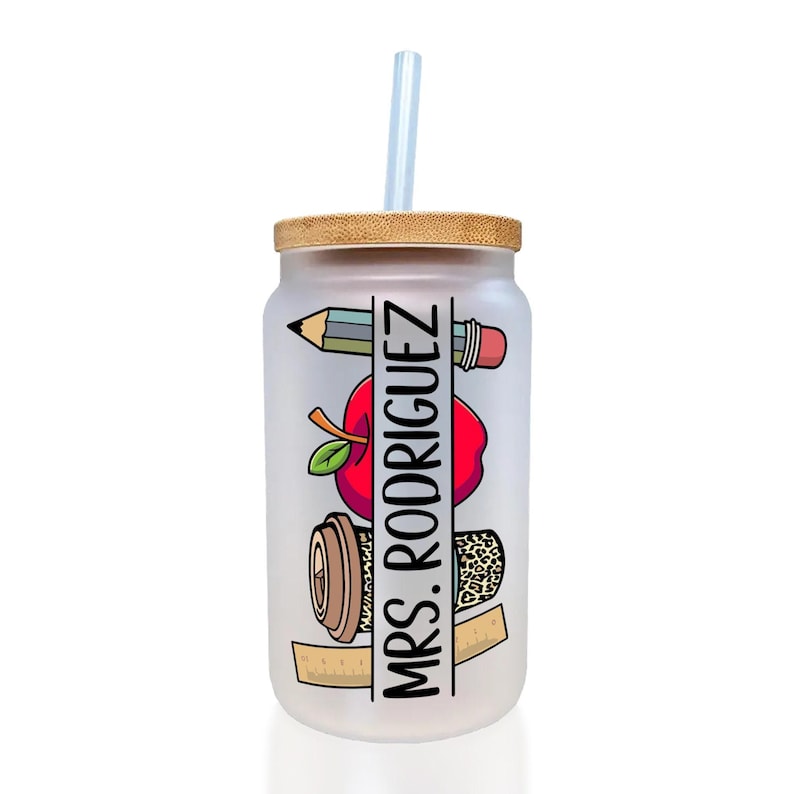 a glass with a straw inside of it