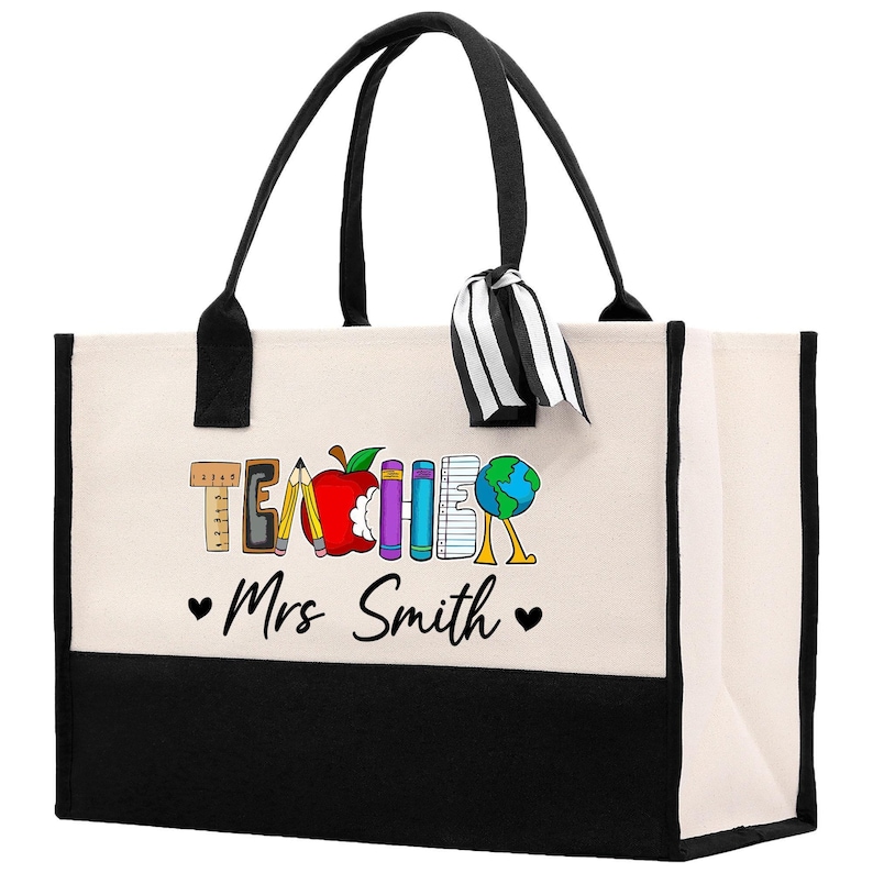 a black and white bag with a teacher's name on it