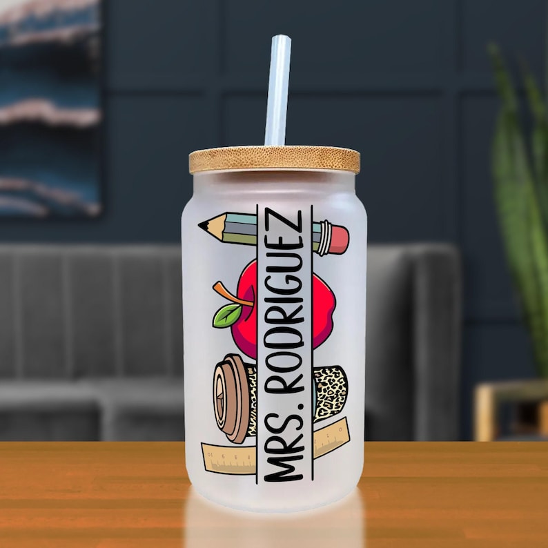a glass with a straw in it sitting on a table
