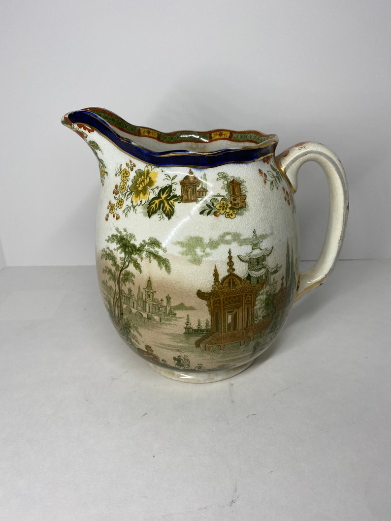 Royal Doulton 64 Ounce Pitcher Madras Pattern Green Makers Mark Floral Rim Green Brown Pagoda