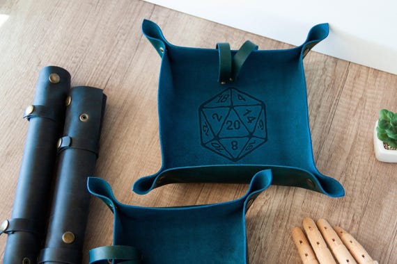Handmade leather catchall tray with a custom engraved scroll design — doubles as a dice tray for tabletop gamers and a stylish desk valet for everyone else.