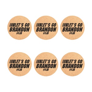 May include: Six round cork coasters with the text "LET'S GO BRANDON #FJB" printed in black.