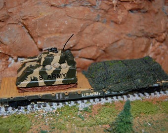 HO Scale US Army flat car w/personnel carrier.