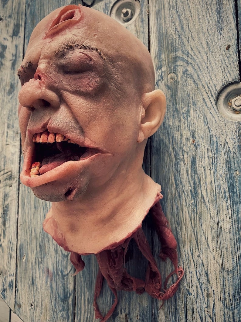 Realistic severed human head out of silicone with hair