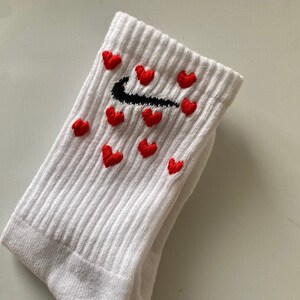 White nike socks deals with red swoosh