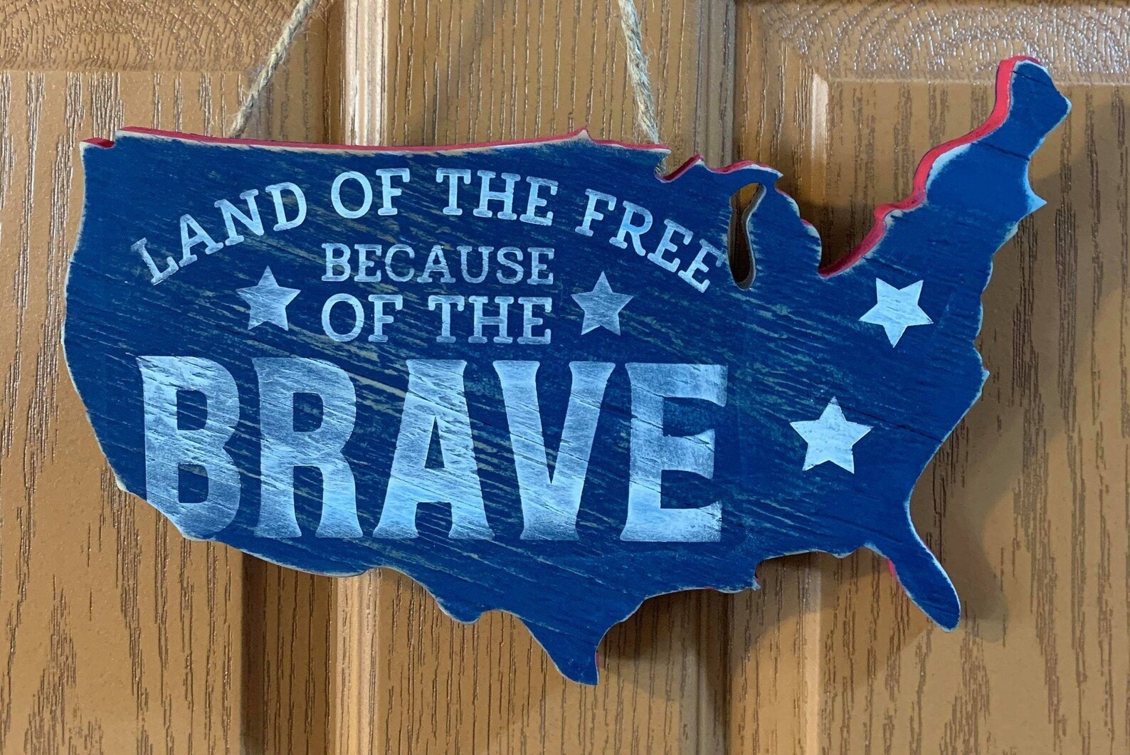 sign that reads land of the free because of the brave sign that reads land of the free because of the brave
