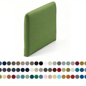 May include: A rectangular, olive green upholstered headboard with rounded top corners. Below the headboard, a grid of seventy-two small, circular fabric swatches is displayed, showcasing a wide variety of solid colors and textured finishes.