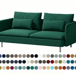 May include: A two-seater sofa upholstered in dark green fabric with two large back cushions and two smaller rectangular lumbar pillows. The sofa features rounded armrests and is supported by four thin, cylindrical silver-colored metal legs.