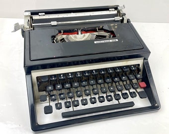 Machine à écrire portable Underwood 320, noire testée et fonctionnelle sans étui