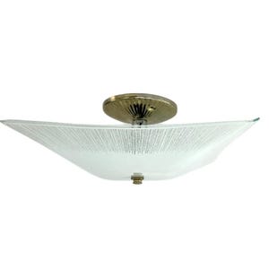 May include: A vintage ceiling light fixture with a frosted glass shade and brass hardware. The shade has a unique, textured pattern. The fixture is designed to be mounted flush against the ceiling. The overall design is mid-century modern.