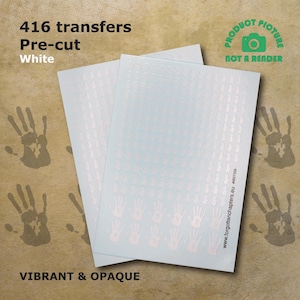 May include: Two sheets of white pre-cut transfer paper with 416 hand-shaped decals. The paper is labelled "416 transfers Pre-cut White" and "VIBRANT & OPAQUE".