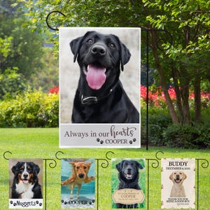 May include: Four garden flags featuring images of dogs and text. The top flag shows a black dog with the text "Always in our hearts COOPER". The other flags depict a Bernese Mountain Dog with the text "Nuggets", a golden retriever swimming with the text "COOPER", a black Labrador with the text "In Loving Memory of COOPER", and a yellow Labrador with the text "BUDDY DECEMBER 8, 2023 Thank you for being a good boy".