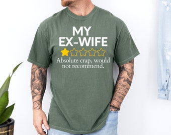 Könnte beinhalten: Ein grünes T-Shirt mit dem Text "My Ex-Wife" und einer Ein-Sterne-Bewertung. Der Text unter der Bewertung lautet "Absolute crap, would not recommend."