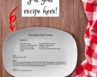 May include: A white ceramic plate with a chocolate chip cookie recipe written on it. The recipe includes ingredients such as white sugar, brown sugar, vanilla extract, baking soda, and chocolate chips. The recipe also includes instructions for preheating the oven to 175 degrees Celsius, mixing the ingredients, and baking the cookies for 10 minutes.