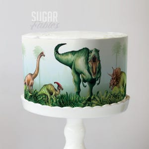 歩き回る恐竜ケーキラップ ジュラシック・パーティー 食べられるイメージ 恐竜の世界アドベンチャー フロスティングシート T-Rex & ジャングル探検家 誕生日デコレーション