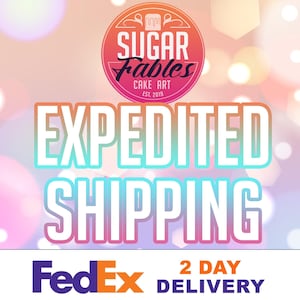 May include: An image with the text "EXPEDITED SHIPPING" in large, colorful letters. The Sugar Fables Cake Art logo is at the top. The FedEx logo and "2 DAY DELIVERY" are at the bottom.