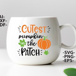 May include: A white ceramic mug featuring the orange and black text "CUTEST pumpkin in the PATCH" with a graphic of an orange pumpkin and two green leaves. The text "-AI- -DXF- -PDF-" appears on the left and "-SVG- -PNG- -EPS-" on the right.