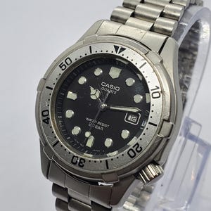 Vintage Casio LD701 Quartz Diver Style Watch Black Dial 32 Mm Vintage Casio LD701 Quartz Diver Style Watch Black Dial 32 Mm