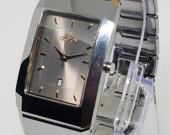 Croton 307985 Reloj suizo de cuarzo con esfera de carburo de tungsteno, esfera gris, cristal de zafiro, en funcionamiento.