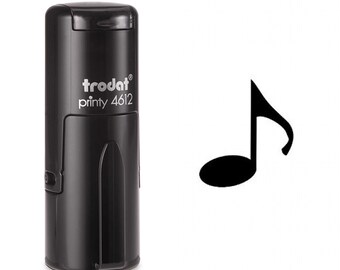 May include: Black self-inking stamp with the text "trodat printy 4612" and a black musical note symbol.