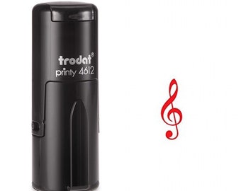 May include: Black self-inking stamp with the text "trodat printy 4612" and a red treble clef symbol.