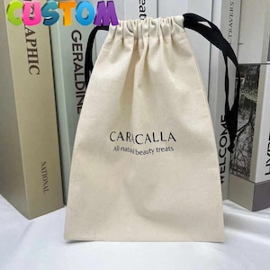 Natürliche Baumwolle Beige Personalisierter Logo-Druck, benutzerdefinierte schwarze Baumwoll-Staubbeutel, Schmuckverpackungsbeutel, Kordelbeutel, hochwertige kleine Baumwolltasche