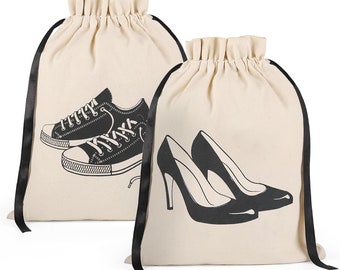May include: Two canvas drawstring bags with black ribbon ties. One bag has a black and white illustration of sneakers, the other has a black and white illustration of high heels.