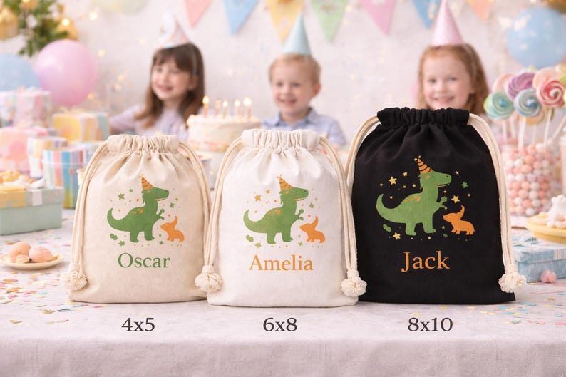 May include: Three drawstring party favor bags in beige, white, and black. Each bag features a green dinosaur and orange animal graphic, with names Oscar, Amelia, and Jack. Sizes are 4x5, 6x8, and 8x10 inches.