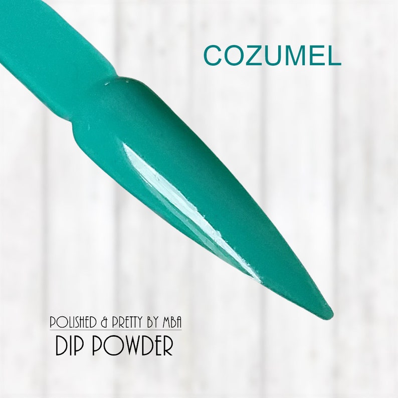 May include: A teal green nail dip powder with the text "COZUMEL" and "POLISHED & PRETTY BY MBA DIP POWDER" on the image.